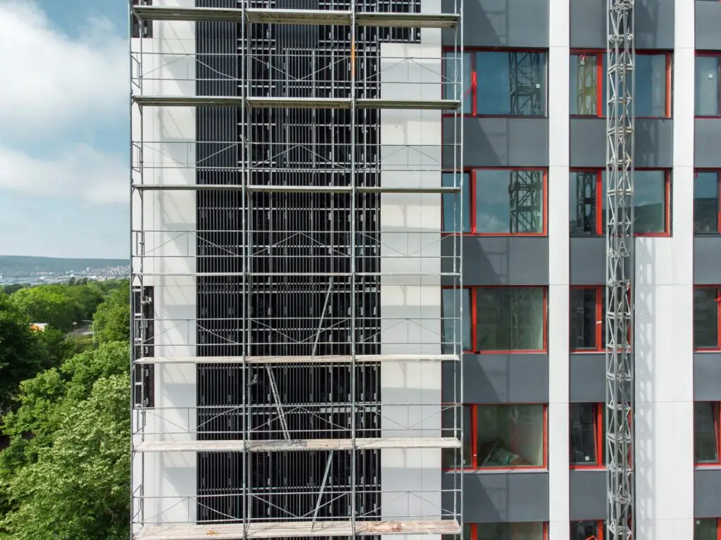 Scaffolding on apartment building facade construction project